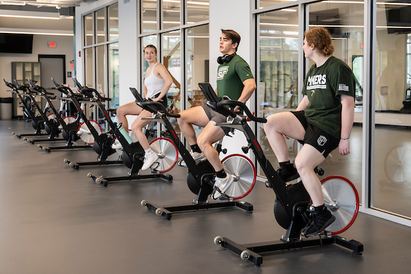 students on exercise bikes